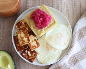 Mangu dish with fried cheese, fried eggs, and avocado on the side for Breakfast Category picture