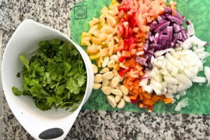 Colorful vegetables chopped and ready to blend for homemade Dominican Sofrito (sazón)