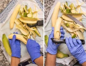 Peeling green plantains with a knife and a vegetable peeler to male tostones