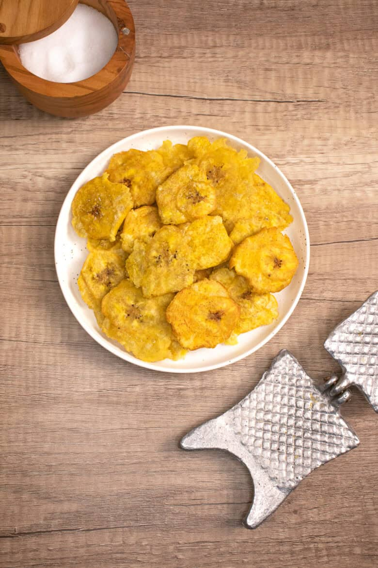 Crispy Dominican tostones made from fried green plantains