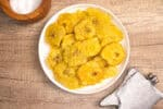 Crispy Dominican tostones made from fried green plantains