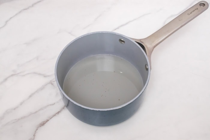 Clear simple syrup in a saucepan after the sugar has dissolved