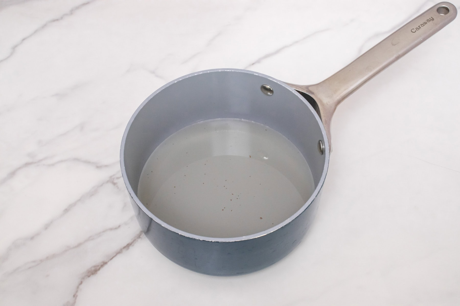 Clear simple syrup in a saucepan after the sugar has dissolved