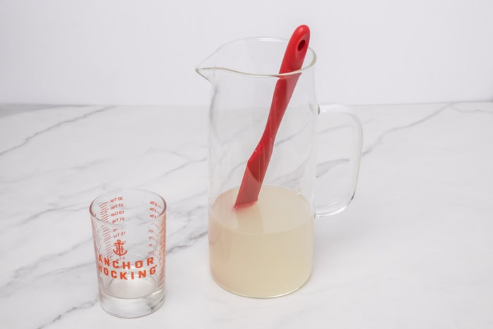 adding the simple syrup and checking for sweetness